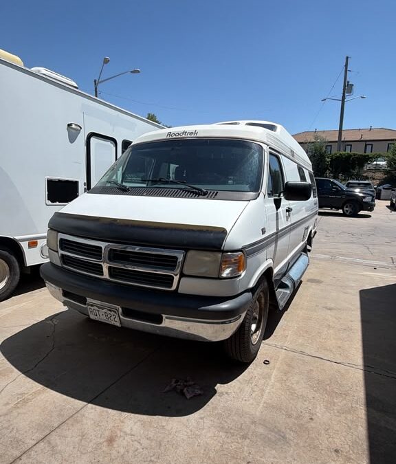 Roadtrek 190 Popular Class B campervan front view at Mile High RV Works after a plumbing repair