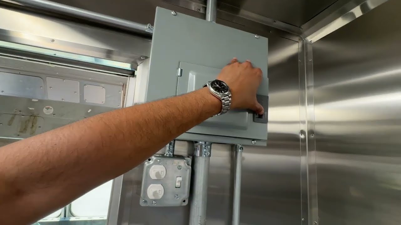 Electrical panel inside the jerk chicken food truck with every piece of equipment on its own labelled breaker