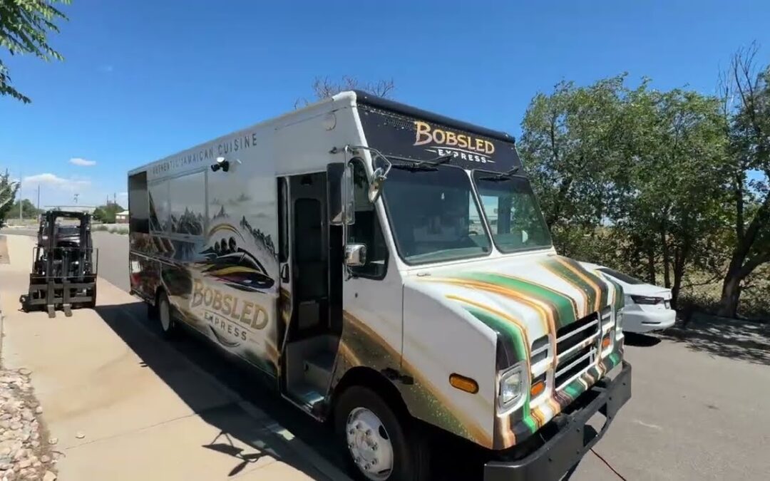 Jamaican jerk chicken food truck built for Laramie, Wyoming, street side with the six foot service window