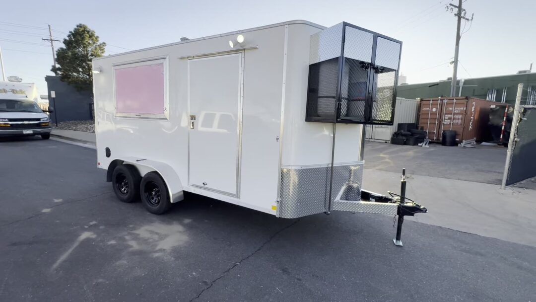 12ft white enclosed food trailer with double axles and a caged propane rack, built for El Paso County, Colorado