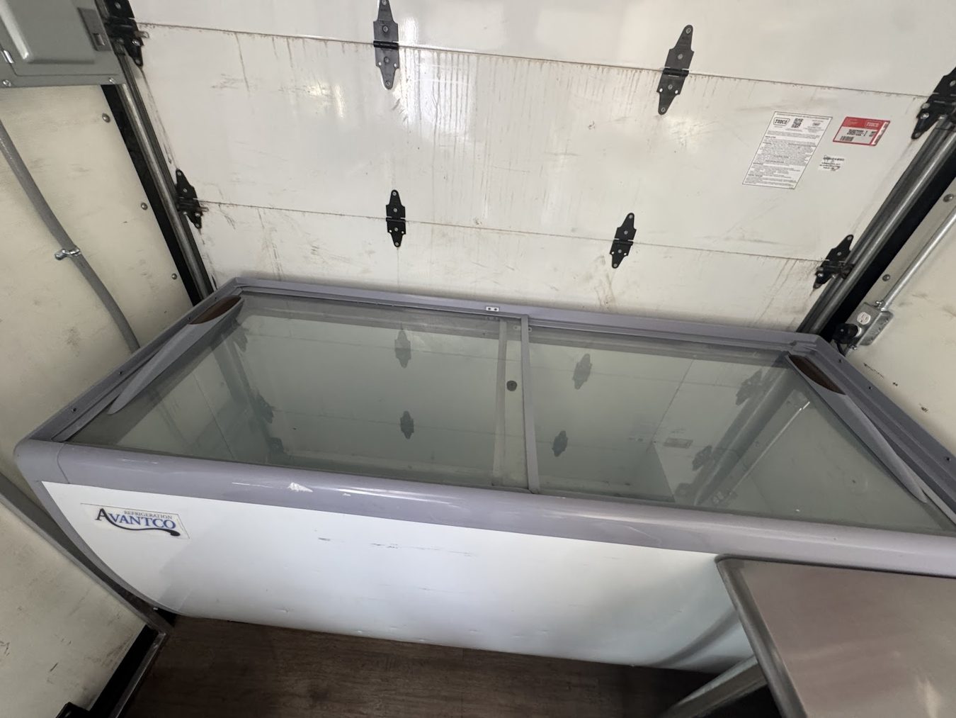 Glass top chest freezer inside the açaí bowl food truck
