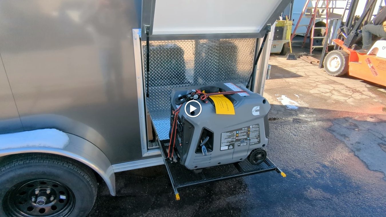 Cummins inverter generator in a vented box on the front of the tempura trailer