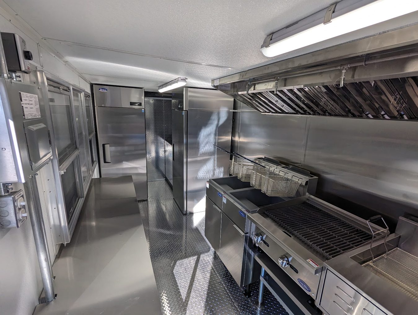 Reach in refrigerator and freezer at the back of the tempura trailer kitchen